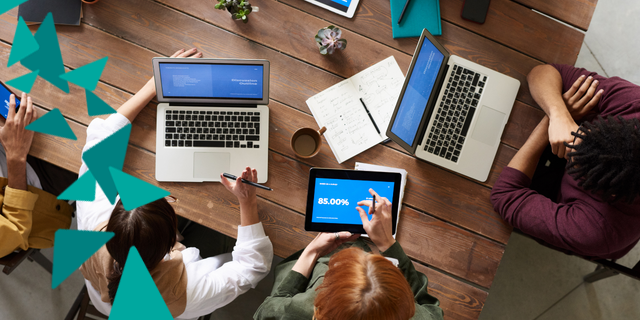 Aerial view of two laptops and a tablet