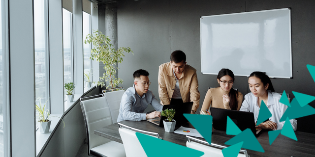 Group of four people in office